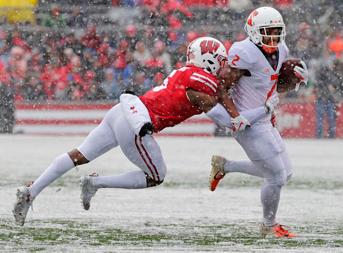 Illinois Fighting Illini running back Reggie Corbin (2) is tackled by Wisconsin Badgers cornerback Rachad Wildgoose (5) in the second quarter of a Big Ten conference football game at Camp Randall Stadium on Saturday, October 20, 2018 in Madison, Wis. Adam Wesley/USA TODAY NETWORK-Wis Gpg Badgersvsillinois 102018 Abw776